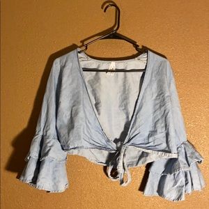 Light blue flair up long sleeve ties in the front